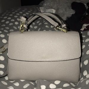 a medium size light gray purse
